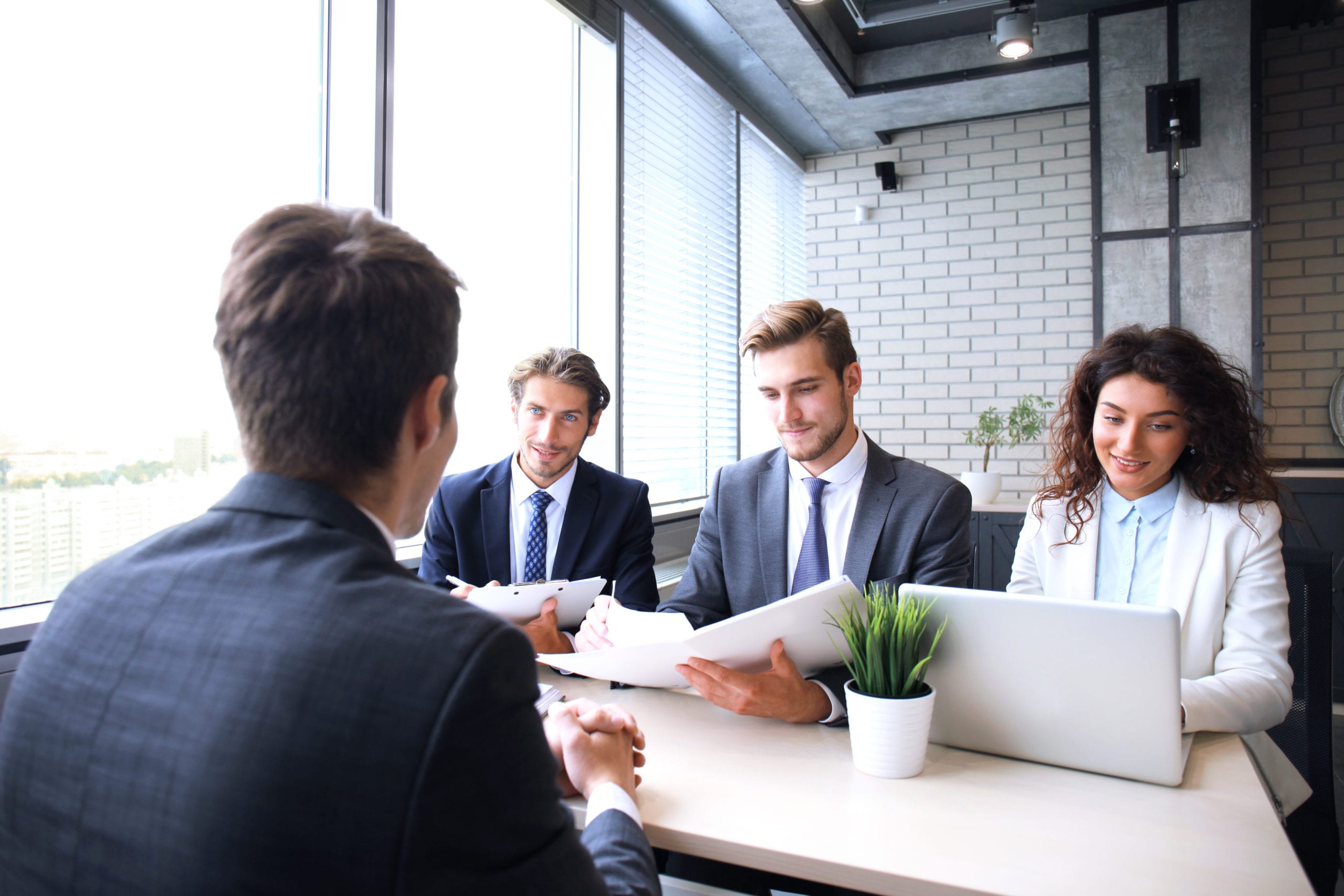 Job interview with the employer, businessman listen to candidate answers